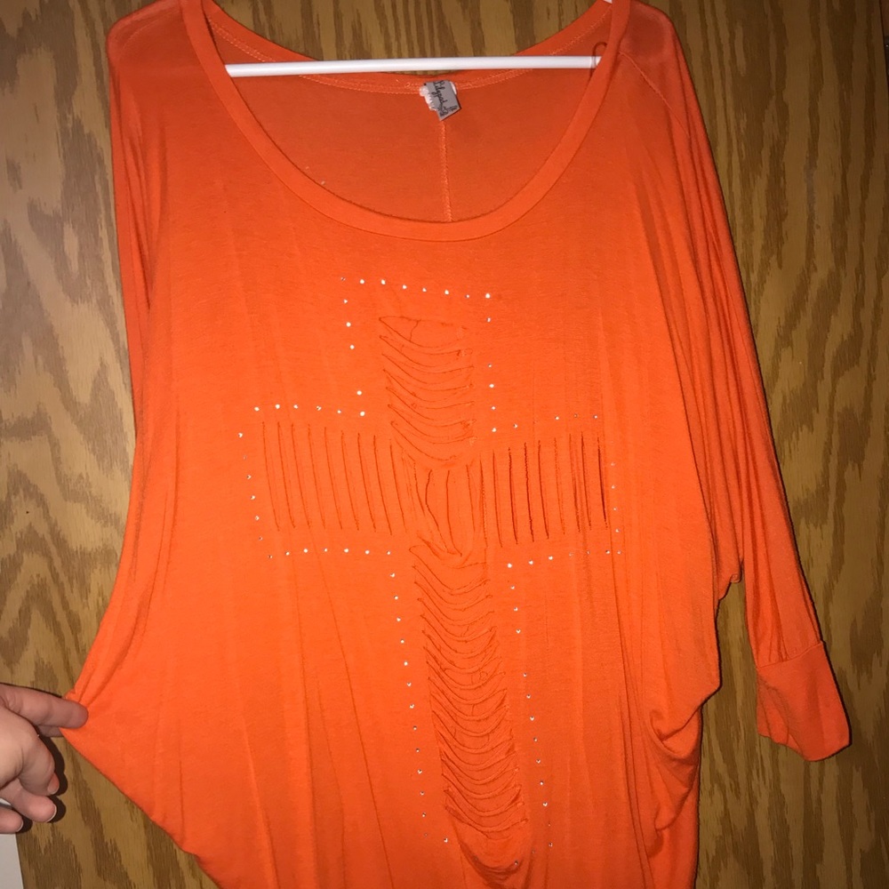 Orange loose fitting woman’s shirt